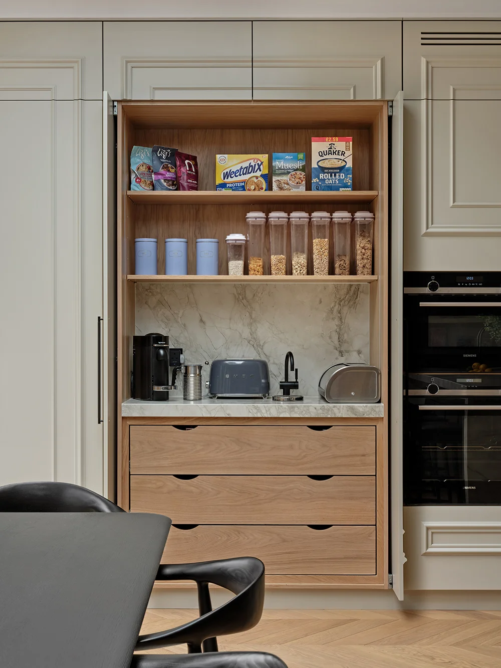 Making a Statement — A concealed pantry with shelves and timber drawers.