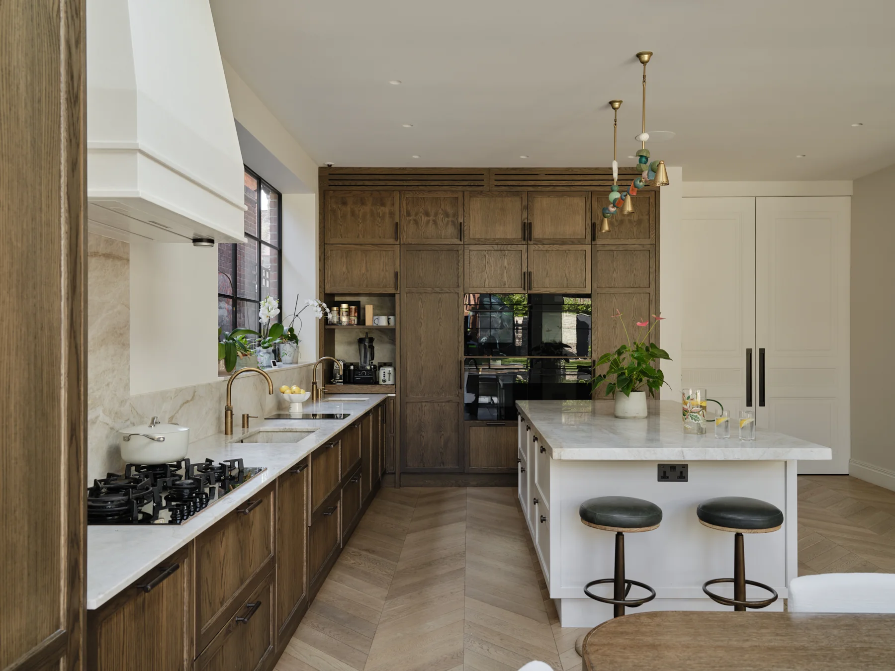 The Kosher Kitchen — A long working aisle connects the cooking area and tall cabinetry.