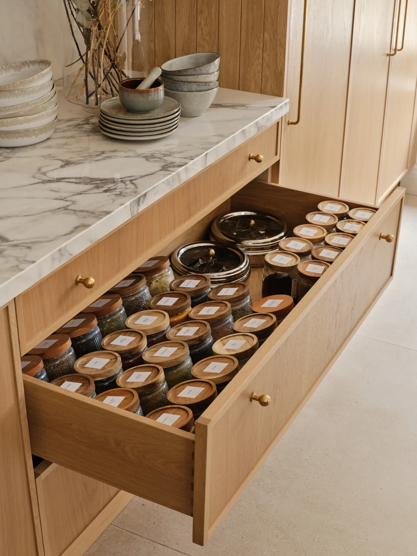 The Modern Sanctuary — A fitted spice drawer keeps everyday ingredients organised.